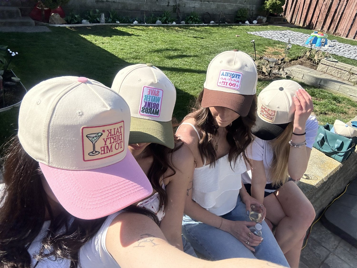 Guests wearing custom hats in different colours